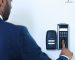 Employee using an Attendance Management System to log working hours and track absences.