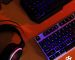 Gaming notebook on a desk with RGB keyboard lighting