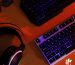 Gaming notebook on a desk with RGB keyboard lighting